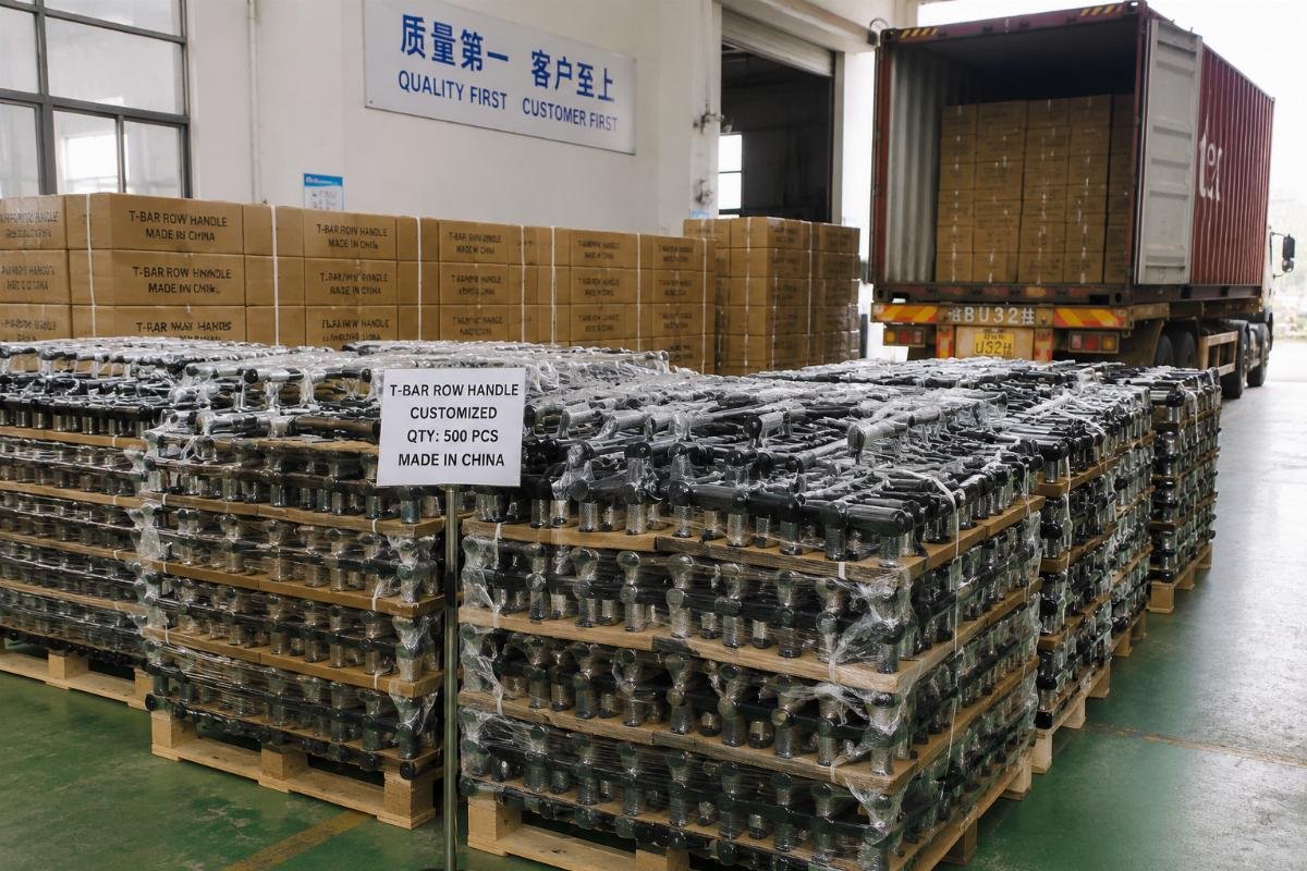 Bulk inventory of customized T-bar row handles before container shipment Bulk packed T-bar row handle products ready for container loading at factory warehouse